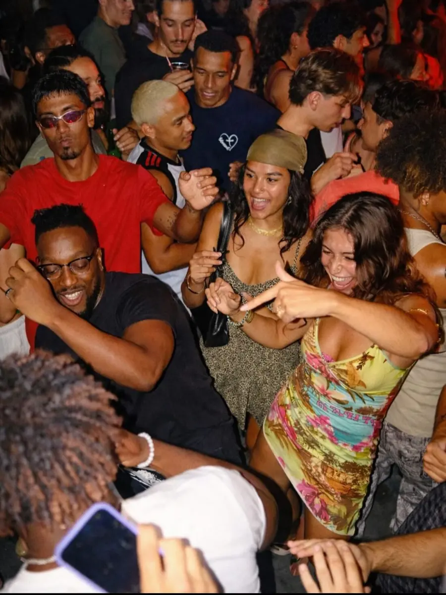 Crowd dancing at an authentic baile funk party at night