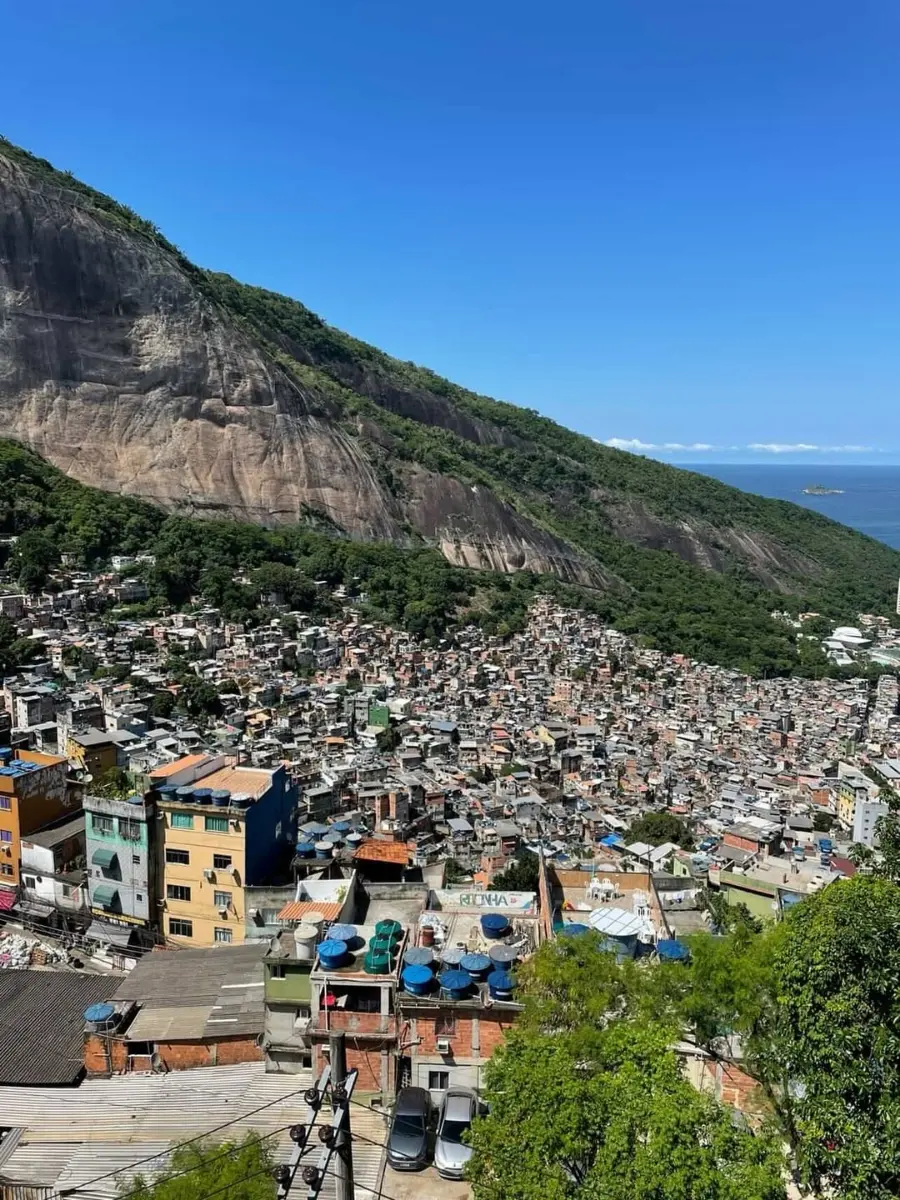 Rocinha spread down the hillside under the bare rock face, the ocean on the horizon